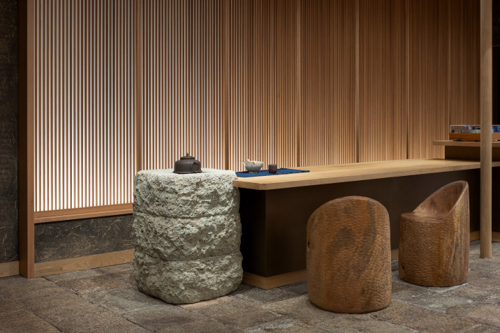 Detail view of 45R's new clothing store in Soho, New York, with tea-warming hearth and bronze-clad customer service counter.