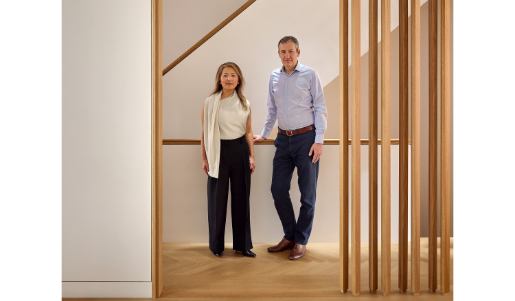YUN Architecture's principals Susan Yun and Felix Ade, standing at the staircase of one of their townhouse projects
